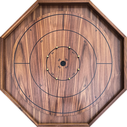 Wooden crokinole board with concentric circles and numbered points on a white background